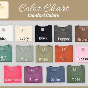 May include: A color chart displaying a variety of Comfort Colors t-shirts. The shirts are arranged in rows and columns, showcasing colors like white, ivory, black, pepper, espresso, light green, bay, khaki, yam, blossom, watermelon, berry, denim, and moss.