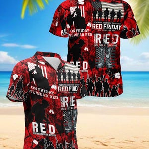 May include: Red Hawaiian shirt with a patriotic design. Features silhouettes of soldiers, the American flag, and the text "On Friday We Wear Red" and "Remember Everyone Deployed". The shirt is short-sleeved.