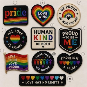 May include: A collection of embroidered patches with LGBTQ+ pride themes. Designs include rainbows, hearts, and phrases like "Pride," "Love Wins," "Be Proud," "All Love Is Equal," "Human Kind," and "Kindness is a Pride."