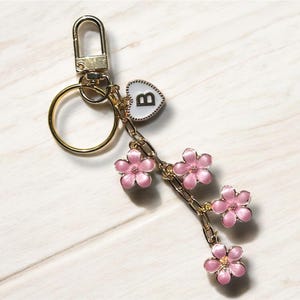 Customizable gold flower initial keychain