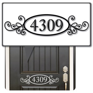 May include: Black and white house number sticker with a decorative scroll design. The sticker features the number 4309 in a white oval with a black outline. The sticker is shown on a white background and on a gray door.