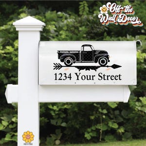 May include: Black and white silhouette of a pickup truck with an arrow pointing to the right. The truck is above the text "1234 Your Street" on a white mailbox.