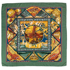 May include: A square silk scarf with a green border and a central design featuring a tree, figures, and musical instruments. The design includes a variety of colors, including blue, orange, yellow, and brown. The scarf has a detailed, artistic design.