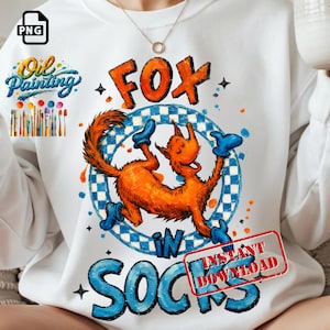 Puede incluir: Sudadera blanca con una ilustración caprichosa de un zorro naranja con calcetines azules, con las palabras "FOX IN SOCKS" en negrita. El diseño incluye un círculo a cuadros y las palabras "Oil Painting".