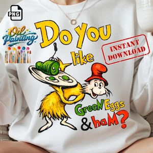 Op de afbeelding: Witte sweatshirt met een grillige illustratie van een personage dat een bord groene eieren en ham vasthoudt. De tekst "Do You like Green Eggs & ham?" wordt in kleurrijke letters weergegeven. Het ontwerp bevat een "Oil Painting" logo en een "PNG" logo.