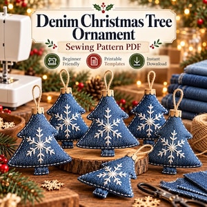May include: A sewing pattern PDF for a denim Christmas tree ornament. The image displays several blue denim tree-shaped ornaments featuring white embroidered snowflake designs, jute twine loops, and metal caps, arranged on a wooden surface.