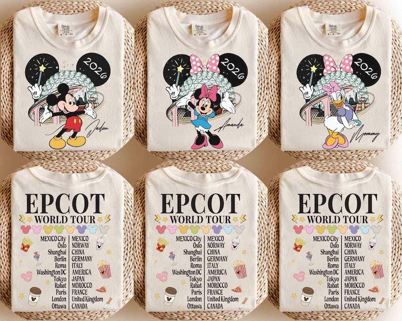May include: Six cream-colored t-shirts with Disney character graphics, including Mickey Mouse, Minnie Mouse, and Daisy Duck, with the year 2026. The bottom shirts feature "EPCOT WORLD TOUR" text with city and country listings.