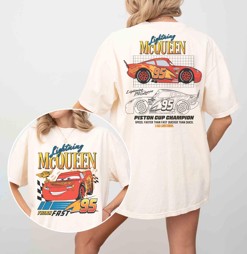 May include: Cream-colored t-shirt featuring Lightning McQueen graphics. The front design includes the text "Lightning McQueen", the number "95", and the phrase "Think Fast". The back displays a larger design with the text "Lightning McQueen", the number "95", and "Piston Cup Champion".
