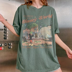 May include: A set of three ceramic mugs with a speckled, matte finish. The mugs are in shades of cream, light gray, and dark gray. Each mug has a simple, minimalist design, perfect for coffee or tea.