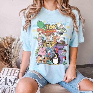 May include: A rustic wooden sign with the text "Welcome to our home" in white lettering. The sign features a distressed finish and a simple, inviting design, perfect for entryway decor.