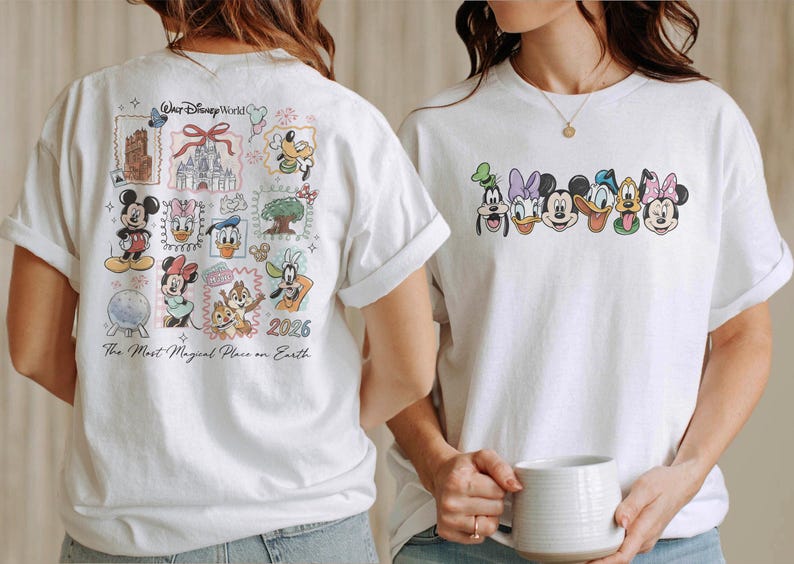 May include: White t-shirts featuring Disney characters. One shirt has a collage of characters and landmarks with "Walt Disney World" and "The Most Magical Place on Earth" text. The other shirt has character faces.