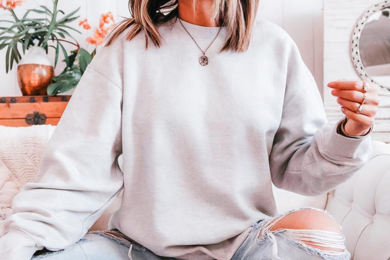 The Gildan 18000 offers everyday comfort with style. Blank sweatshirt for daily wear, lounge looks, or layering. Soft fleece interior, classic crewneck fit, and print-friendly exterior. Customize it for Etsy, Shopify, or personal use. A customer favorite for soft feel and print clarity.