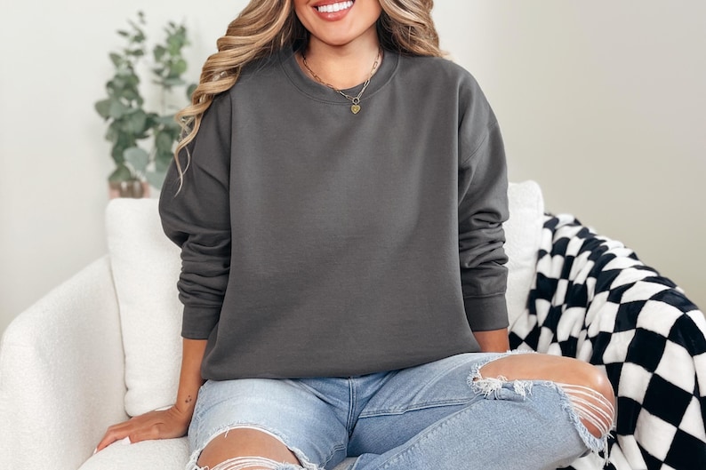 Cozy and customizable, the Gildan 18000 is perfect for fall and winter printing. Soft fleece interior, crewneck style, and durable cotton/poly blend. Add your design with HTV, DTF, or embroidery. A best-seller for seasonal merch, events, and cold-weather comfort. A reliable blank for small shops and bulk sweatshirt orders.