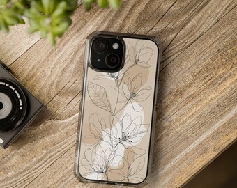 Puede incluir: Una funda transparente para smartphone con una delicada ilustración de líneas negras de flores y hojas sobre formas abstractas de color beige y crema. El diseño cubre la parte posterior del teléfono, que tiene un sistema de cámara dual.