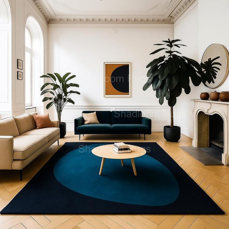Hand tufted abstract navy blue wool rug with geometric color block design styled in modern minimalist living room