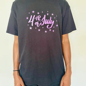 4th of July Graphic Tee – Unisex Black T-Shirt with Purple Stars | Independence Day Shirt | Patriotic Summer Wear for men & women