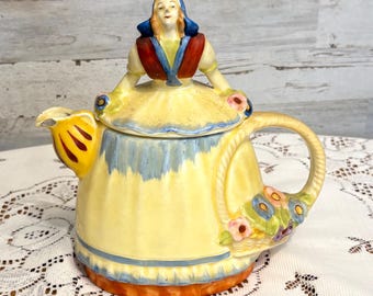 Vintage Ceramic Teapot with a Dutch Woman Figurine Lid and Floral Accents 1900-1930