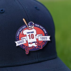 May include: Navy blue baseball cap with a baseball-themed patch. The patch features a baseball player illustration, the number 10, and the text "Your Name", "Your Text Here", "Since 1993", and "Your Logo".
