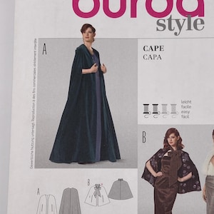 May include: A Burda Style 7154 sewing pattern envelope for a cape. The front displays three variations of capes labeled A, B, and C, with illustrations of the garment shapes and sizing information for US sizes 10 through 24 and EUR sizes 36 to 50.