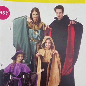 May include: McCall's Costumes pattern MP446 featuring costume designs. The cover shows four people wearing different costumes, including a witch, a hooded figure, and two individuals in capes. The word "EASY" is printed on the cover.