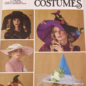 May include: Simplicity S3031 Costumes sewing pattern envelope featuring illustrations of various hats including a black lace veil hat, a purple witch hat with butterflies, a pink floral hat, a green witch hat, and a blue witch hat with white flowers.