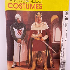 May include: A vintage McCall's Costumes pattern envelope showing two medieval knight costume designs. The yellow envelope has red text and illustrations of the costumes, including a knight in a helmet and a king with a crown, both holding swords.