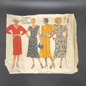 May include: Vintage Vogue's Basic Design sewing pattern. The pattern envelope features illustrations of four women in dresses. The dresses are in red, black, yellow, and floral print. The pattern number is 1569.