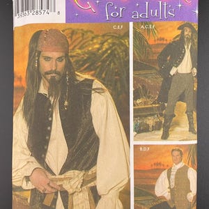 May include: A Simplicity sewing pattern envelope 4923 for adult costumes. The packaging features illustrations of pirate-themed outfits including a long-sleeved shirt, vest, pants, and headscarf, with text reading Costumes for adults and size BB L,XL.