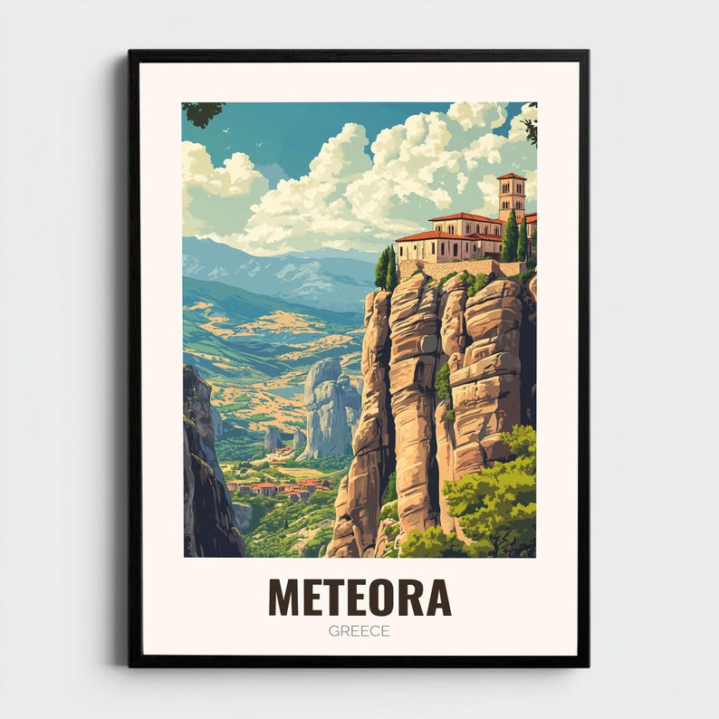 May include: A framed art print showcasing Meteora, Greece. The image presents a monastery perched on a rock formation, set against a backdrop of mountains, valleys, and a cloudy sky. The word "METEORA" is printed at the bottom of the print.