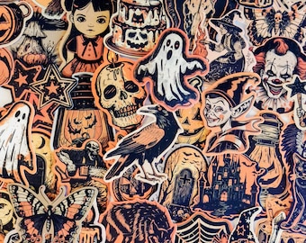May include: A collection of Halloween-themed stickers in orange, black, and white. The stickers feature ghosts, skulls, a raven, a witch, a clown, a haunted house, and other spooky designs. The stickers are arranged closely together.