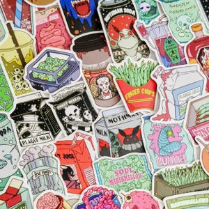 May include: A collection of die-cut stickers featuring horror-themed food and drink illustrations, including Mothman Soda, Vampire Coffee, Finger Chips, Plague Milk, Ghost Cereal, Plasma Milk, Bone Wafers, Soul Marshmallow, and Worm Gummies.