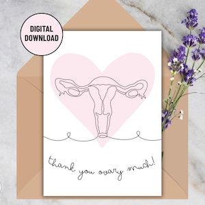 May include: A digital download card with a pink heart and a line drawing of a uterus. The card reads "thank you ovary much!" in black script. The card is in a brown envelope with a sprig of purple flowers.