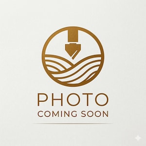 May include: A circular gold logo featuring a stylized fountain pen nib pointing downward toward wavy lines. Below the circular icon, the text reads PHOTO COMING SOON in a clean, sans-serif font, centered on a plain, light-colored background.