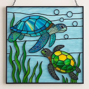 May include: Stained glass panel featuring two sea turtles swimming in a blue ocean with green seaweed. The turtles have blue, green, and yellow shells. The panel is framed in black and has a chain for hanging.