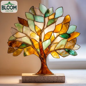 Könnte beinhalten: Eine Buntglas-Baumskulptur mit braunem Stamm und Ästen sowie bunten Blättern in Grün-, Gelb- und Weißtönen. Der Baum steht auf einem rechteckigen Betonsockel. Das Bloom Vector-Logo befindet sich in der oberen linken Ecke.