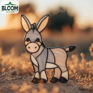 May include: A stained glass donkey figurine in shades of gray, tan, and brown, with gold accents on the ears. The Bloom Vector logo is in the upper left corner. The donkey is standing in a field of dry grass.