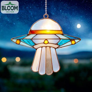 May include: A stained glass UFO-shaped hanging lamp with a chain. The lamp features a white, blue, and orange colour scheme with a light shining from within. The lamp has a decorative design and the text "BLOOM VECTOR" is in the upper left corner.