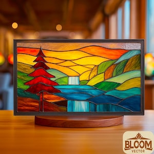 May include: Stained glass panel depicting a mountain landscape with a red tree, waterfall, and colorful sky. The artwork is set in a black frame and displayed on a wooden stand. The Bloom Vector logo is visible in the bottom right corner.