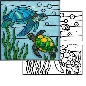 May include: Stained glass art featuring two sea turtles swimming underwater. The top turtle is blue and green, the bottom turtle is green and yellow. Bubbles and seaweed are also visible. The artwork is framed in a black square.