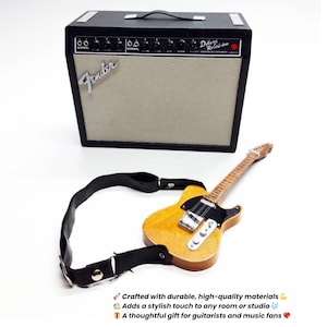 May include: A miniature guitar amplifier and a yellow electric guitar with a black strap. The amplifier is black with a tan speaker cover and the Fender logo. The guitar has a wooden body and neck. The text in the image says: Crafted with durable, high-quality materials.