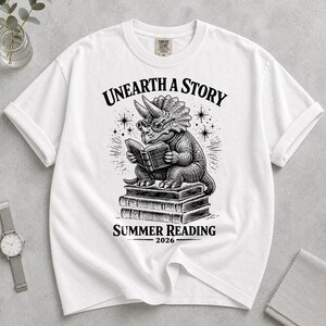 Comfort Colors Summer Reading 2026 Shirt Unearth The Story Dinosaur Book Lover Teacher Librarian Student Back to School Retro Reading Gift image 11