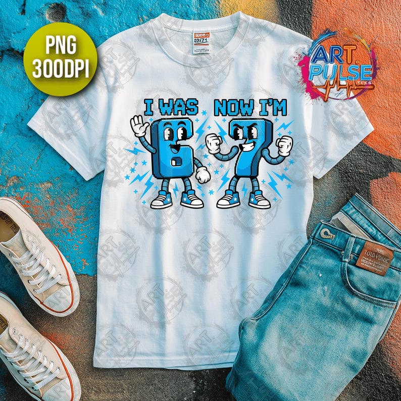 May include: White t-shirt with the text "I WAS NOW I'M" and cartoon-style numbers 6 and 7. The numbers are blue with white accents and are depicted with arms, legs, and shoes. A pair of jeans and sneakers are also in the image.