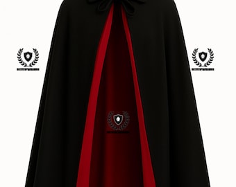 May include: A black cape with a red lining. The cape has a collar with a bow and decorative emblems. The interior is a deep red, contrasting with the black exterior. The cape is designed for formal occasions.