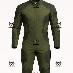 May include: Olive green jumpsuit with a high collar and a zip-up front. The suit features reinforced panels on the shoulders, elbows, and knees. The design includes a series of decorative emblems. The overall style suggests a tactical or military-inspired garment.