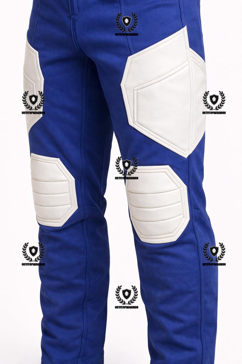May include: Blue pants with white padded accents on the knees and thighs. The pants have a streamlined design, with the white padding providing a contrasting element. The pants appear to be made of a durable material.