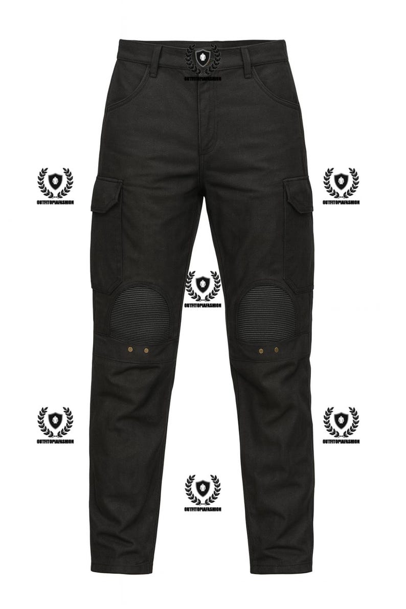 May include: Black cargo pants with reinforced knee panels and two side pockets. The pants have a decorative emblem on the waistband and are made of a durable fabric. The pants are designed for a rugged, utilitarian look.