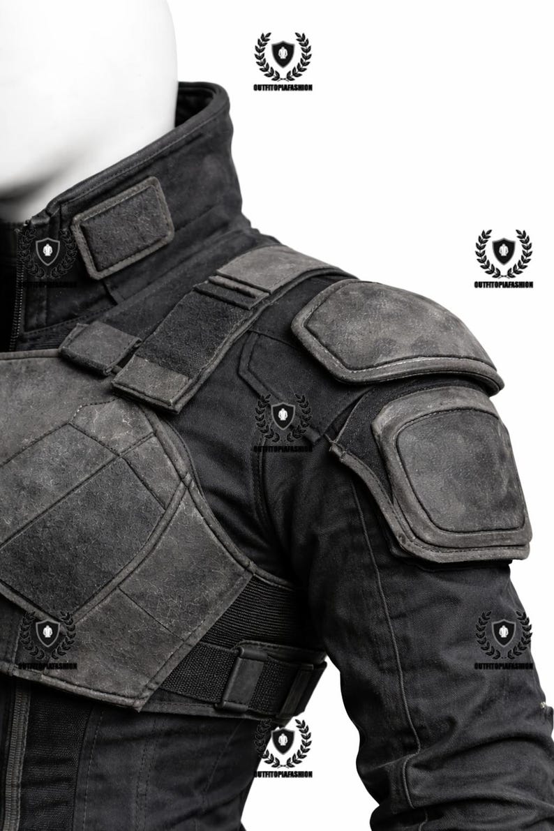 May include: Black jacket with reinforced shoulder pads and a high collar. The jacket features multiple panels and a textured, weathered appearance. The design includes a combination of smooth and padded sections, with a fitted waist and elastic band.