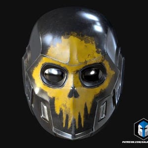 May include: A metallic black and yellow helmet with a skull design. The helmet has a glossy finish and features eye openings and ventilation slots. The skull design is painted in yellow, with a distressed, worn appearance.