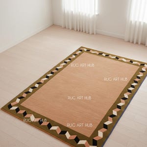 May include: A rectangular area rug with a tan center and a geometric border. The border features a repeating pattern of black, white, and pink shapes on a green background. The text "RUG ART HUB" is printed on the rug.