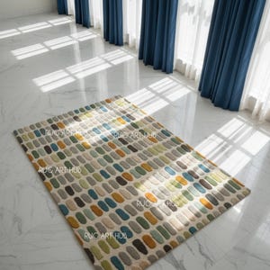 May include: A rectangular rug featuring a pattern of colourful, oblong shapes in shades of blue, green, yellow, and grey. The rug is on a white marble floor, with blue curtains in the background. The text "RUG ART HUB" is printed on the rug.